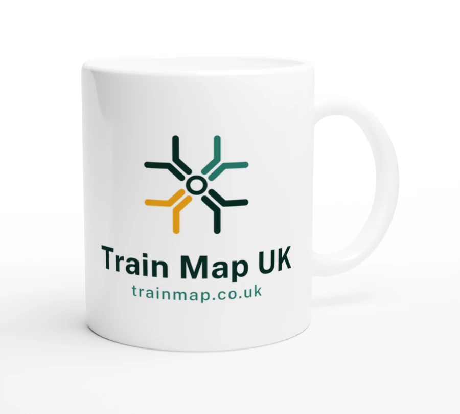 An 11 oz glossy white ceramic mug carrying the Train Map UK junction mark, the name and the address